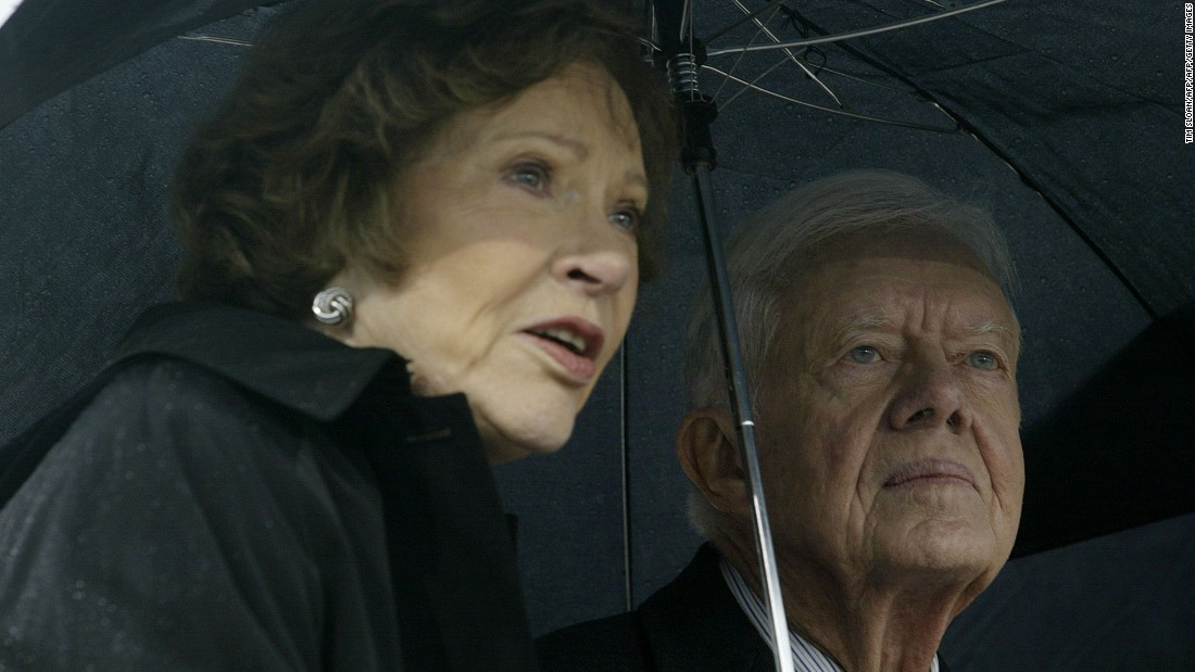 The Carters attend the grand opening ceremony of the William J. Clinton Presidential Center in Little Rock, Arkansas, in November 2004.