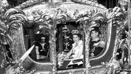 Queen Elizabeth II with Prince Philip, Duke of Edinburgh, in the Coronation Coach en route to Westminster Abbey for Elizabeth&#39;s coronation ceremony, June 2,1953. 