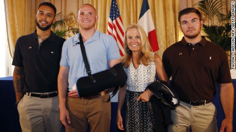 Off-duty US servicemen Anthony Sadler (L), Spencer Stone (2nd L), Alek Skarlatos (R) and US ambassador to France Jane Hartley (2nd R) pose after a press conference at the US embassy in Paris on August 23,  two days after 25-year-old Moroccan Ayoub El-Khazzani opened fire on a Thalys train travelling from Amsterdam to Paris, injuring two people before being tackled by several passengers including off-duty American servicemen.