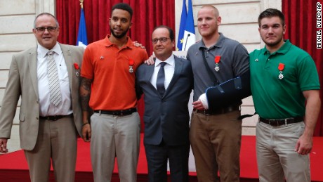 From the left, British businessman Chris Norman,  Anthony Sadler, a senior at Sacramento University in California, French President Francois Hollande, U.S. Airman Spencer Stone, and Alek Skarlatos a U.S. National Guardsman from Roseburg, Oregon pose at the Elysee Palace, Monday Aug.24, 2015 in Paris, France. Hollande  pinned the Legion of Honor medal on U.S. Airman Spencer Stone, National Guardsman Alek Skarlatos, and their years-long friend Anthony Sadler, who subdued the gunman as he moved through the train with an assault rifle strapped to his bare chest. The British businessman, Chris Norman, also jumped into the fray. (AP Photo/Michel Euler, Pool)