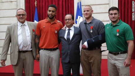 From the left, British businessman Chris Norman,  Anthony Sadler, a senior at Sacramento University in California, French President Francois Hollande, U.S. Airman Spencer Stone, and Alek Skarlatos a U.S. National Guardsman from Roseburg, Oregon pose at the Elysee Palace, Monday Aug.24, 2015 in Paris, France. Hollande  pinned the Legion of Honor medal on U.S. Airman Spencer Stone, National Guardsman Alek Skarlatos, and their years-long friend Anthony Sadler, who subdued the gunman as he moved through the train with an assault rifle strapped to his bare chest. The British businessman, Chris Norman, also jumped into the fray. (AP Photo/Michel Euler, Pool)