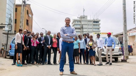 Mark Essien with his growing Hotels.ng team on Olonade street in Sabo, Yaba, Lagos.