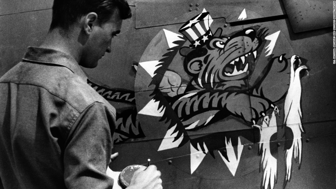 An artist of the China Air Task Force Fighter Command of the United States Army Air Force puts the finishing touches on the insignia of a U.S. plane. The pilots were known as &quot;Flying Tigers.&quot;  