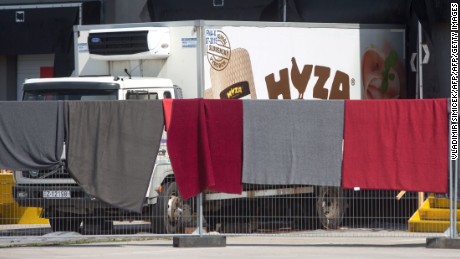 A refrigerated truck, in which bodies of 71 migrants have been found on the A 4 Austrian highway, is parked in a facility which used to be a veterinary station at the border in Nickelsdorf, Austria on August 28, 2015. Austrian police said Friday that three people were in custody in Hungary over the discovery of 71 dead migrants in an abandoned truck with Hungarian number plates.  AFP PHOTO / VLADIMIR SIMICEK        (Photo credit should read Vladimir Simicek/AFP/Getty Images)