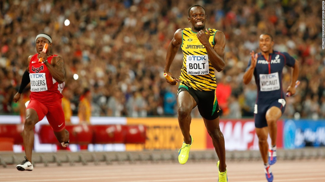 Usain Bolt of Jamaica crosses the finish line to win gold in the men&#39;s 4x100 metres relay final ahead of Mike Rodgers of the United States at the 2015 World Athletics Championships in Beijing.
