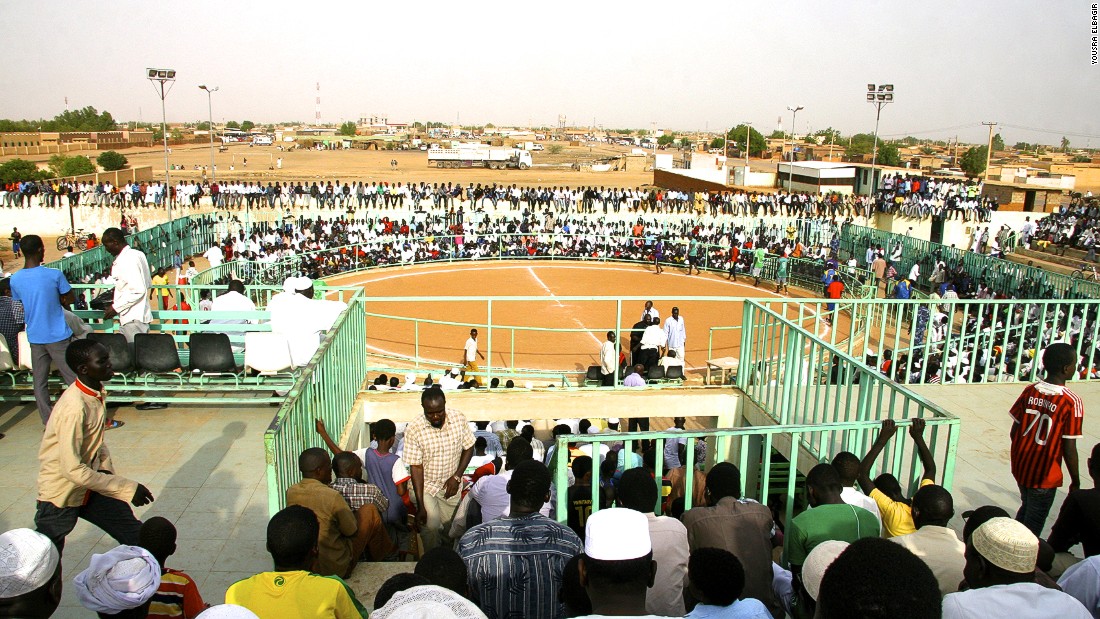 Arenas such as this one in Hajj Yousif, Khartoum, host the events. The ring is far larger than that used in Olympic wrestling and is covered with sand rather than softer, vinyl-covered mats.