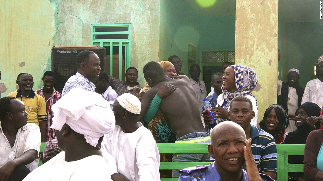 Wrestling arenas are male-dominated environments, but some women, including mother of the victorious wrestler Mujahid, do attend.