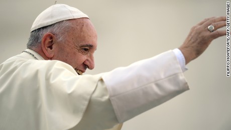 Pope Francis waves to the crowd aboard his Popemobile as he arrives for an audience with participants of an international pilgrimage of altar servers on August 4, 2015 in Saint Peter&#39;s Square at the Vatican. AFP PHOTO / FILIPPO MONTEFORTE        (Photo credit should read FILIPPO MONTEFORTE/AFP/Getty Images)