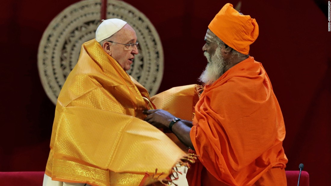 Hindu priest Kurukkal SivaSri T. Mahadeva presents a shawl to Pope Francis in Colombo, Sri Lanka, on Tuesday, January 13, 2015.