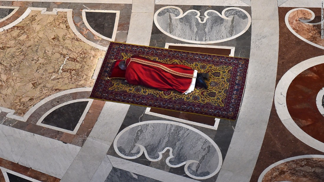 The Pope prays face down on the floor of St. Peter&#39;s Basilica during Good Friday celebrations at the Vatican on Friday, April 3, 2015.
