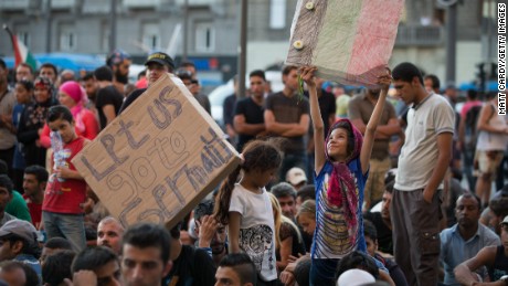 &#39;Merkel! Merkel!&#39;: Migrants beg for help from Germany