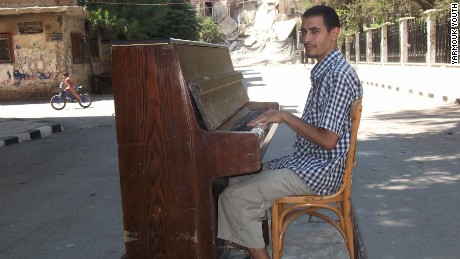 ISIS destroyed his piano, but he plays on