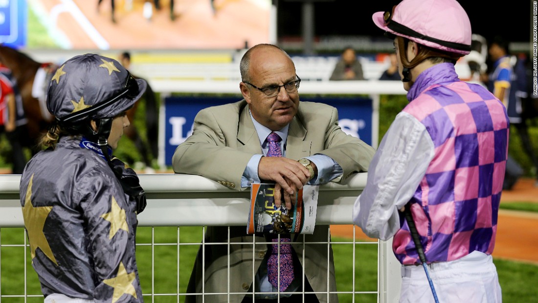 Richard Fahey (center) speaks with jockeys Hayley Turner (left) and James Doyle at Dubai&#39;s Meydan Racecourse in 2014. Of Bell he told CNN: &quot;She&#39;s very talented is Sammy. She doesn&#39;t complicate things. She&#39;s got a great racing brain.&quot;