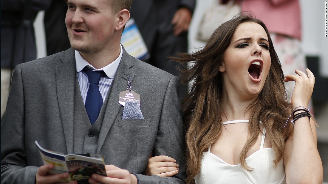 YORK, ENGLAND - AUGUST 21: A racegoer cheers her horse on at York racecourse on August 21, 2015 in York, England. (Photo by Alan Crowhurst/Getty Images)