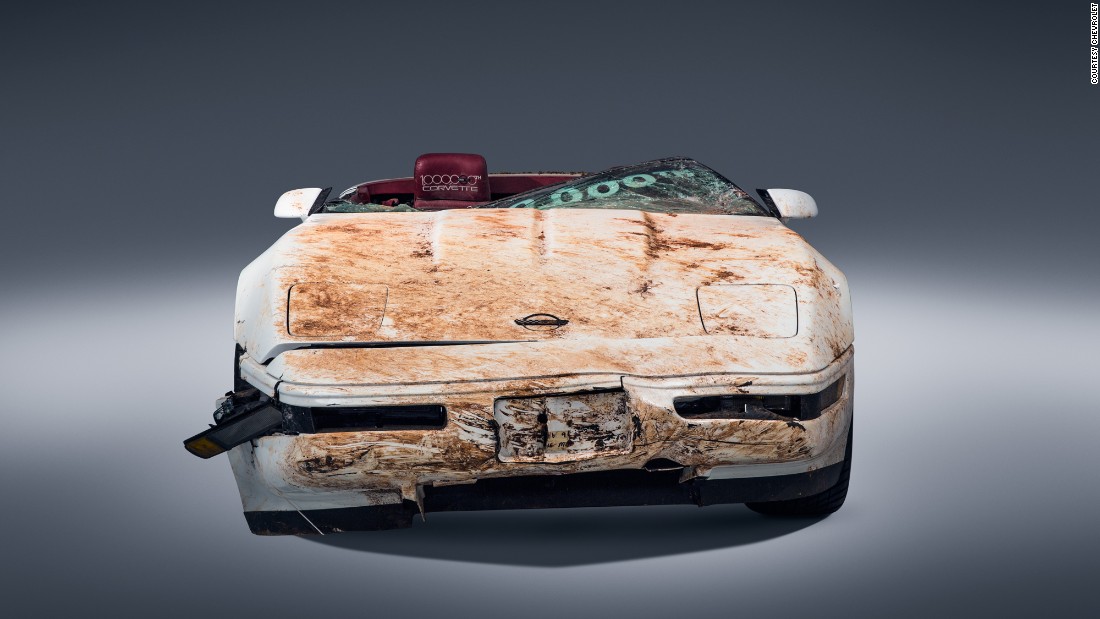 The white LT1 convertible roadster came off the assembly line in 1992. Last year, the sinkhole did this to it. Note the severe damage to the hood, the windshield and the front fascia.