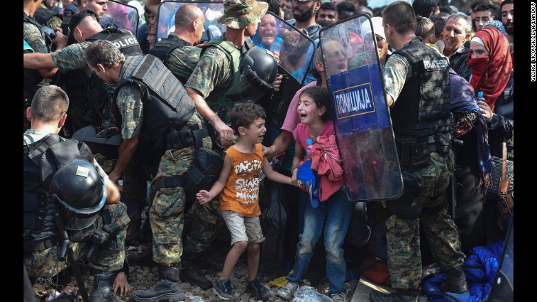 Children cry as migrants in Greece try to break through a police cordon to cross into Macedonia in August 2015. Thousands of migrants -- most of them fleeing Syria&#39;s bitter conflict -- were stranded in a &lt;a href=&quot;http://www.cnn.com/2015/08/22/europe/europe-macedonia-migrant-crisis/&quot; target=&quot;_blank&quot;&gt;no-man&#39;s land&lt;/a&gt; on the border.