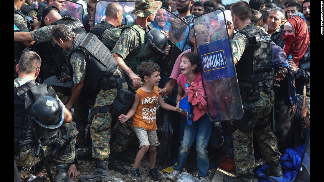 Children cry as migrants in Greece try to break through a police cordon to cross into Macedonia in August 2015. Thousands of migrants -- most of them fleeing Syria&#39;s bitter conflict -- were stranded in a &lt;a href=&quot;http://www.cnn.com/2015/08/22/europe/europe-macedonia-migrant-crisis/&quot; target=&quot;_blank&quot;&gt;no-man&#39;s land&lt;/a&gt; on the border.