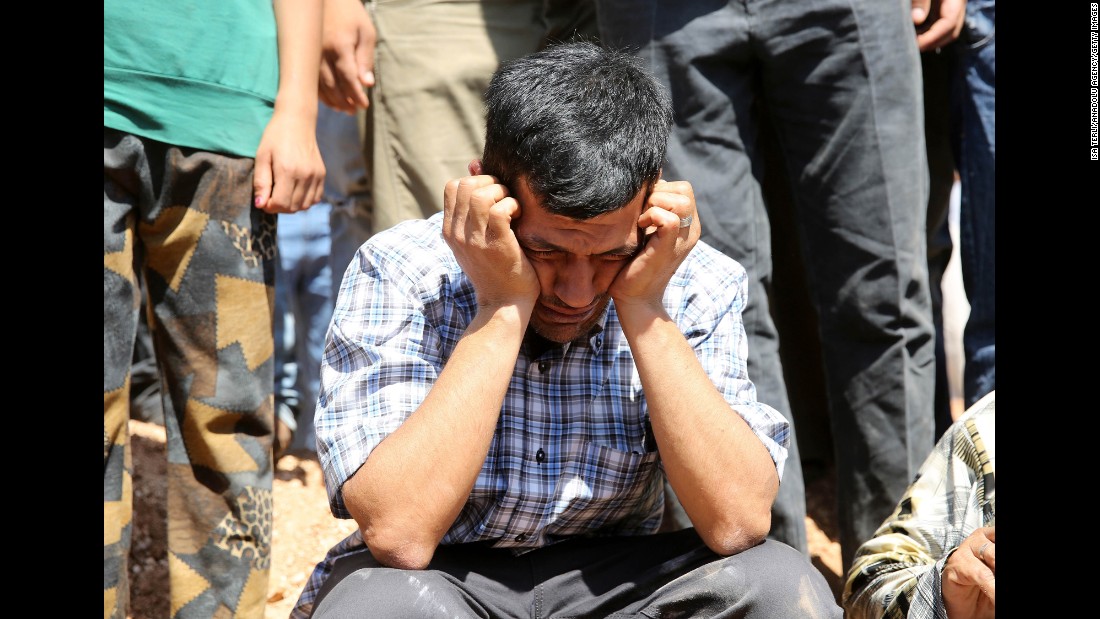 Abdullah Kurdi, the boys&#39; father and widower of Rehen, mourns during the funeral in Kobani on September 4, 2015.