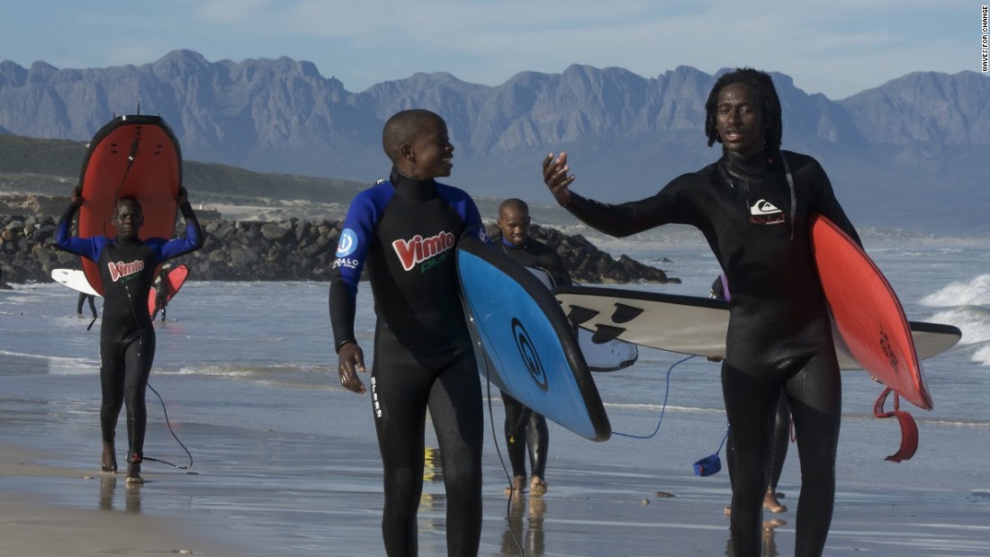 Surfing creates a perfect platform for mentoring. Apish Tshetsha (r) is a Waves for Change coach. All W4C coaches are local community members, trained to engage with kids referred into their programs for behavioral and emotional issues. 