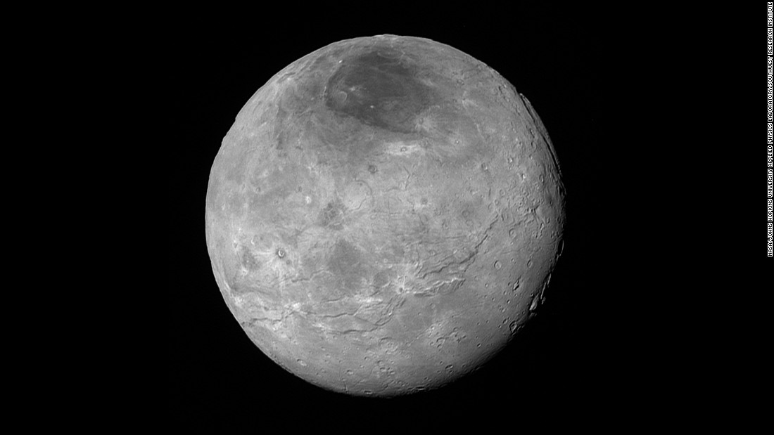 Just before its closest approach to Pluto on July 14, NASA&#39;s New Horizons spacecraft snapped this photo of Charon, Pluto&#39;s largest moon. The photo was shot at a distance of 290,000 miles away. Charon&#39;s north pole region is markedly dark. This photo was released on September 10.