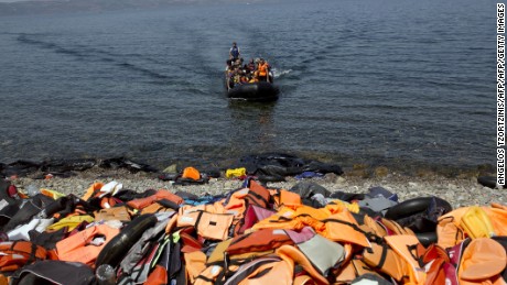 Migrants slash boats, dump life vests on Greek shores