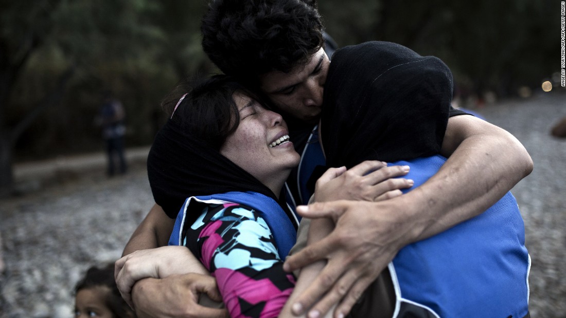 A woman cries after arriving on the island of Lesbos, after crossing the Aegean Sea from Turkey on a dinghy on September 10.