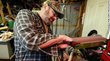 ORIG  Rob Kerr / The Bulletin  Prineville, Ore. Mon. Nov. 18, 2013 
Seventeen months after a stray cat bit him and gave him the plague, Paul Gaylord is back to the craft of making knives at his home workshop. 