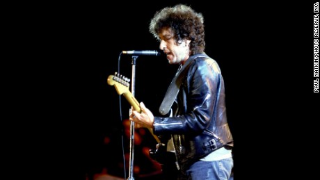 Bob Dylan performs at a  Farm Aid concert in 1985.
