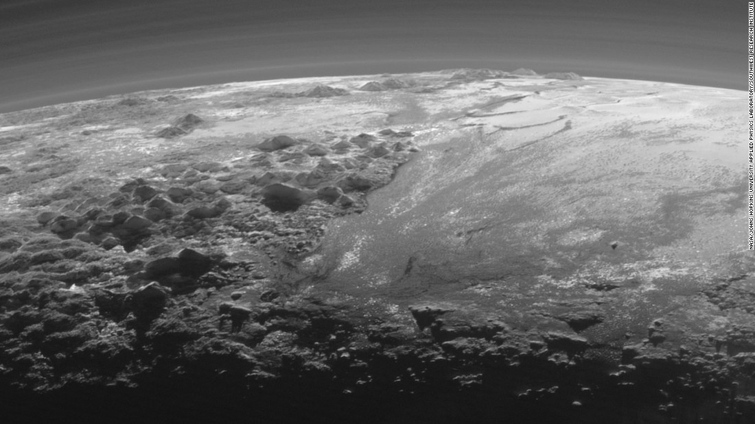 This image of Pluto&#39;s icy and mountainous landscapes was taken from a distance of 11,000 miles (17,700 kilometers). &quot;This image really makes you feel you are there, at Pluto, surveying the landscape for yourself,&quot; said New Horizons Principal Investigator Alan Stern of the Southwest Research Institute in Colorado.