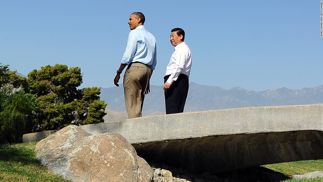 Both forgoing neckties, Barack Obama and Xi Jinping take a late-morning stroll at the Annenberg Retreat at Sunnylands, a private estate in California known for hosting Frank Sinatra and Ronald Reagan, on June 8, 2013. The summit, held just four months after Xi took office, was meant to forge a close relationship with the new Chinese leader. 