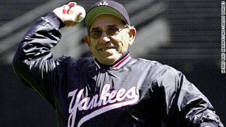 The retired legendary catcher throws out the first pitch to start the Yankees&#39; home season in April 2000. 