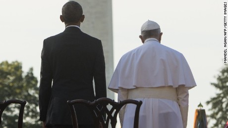 US President Barack Obama stands alongside Pope Francis during an arrival ceremony on the South Lawn of the White House in Washington, DC, September 23, 2015. More than 15,000 people packed the South Lawn for a full ceremonial welcome on Pope Francis&#39; historic maiden visit to the United States. AFP PHOTO / MANDEL NGAN        (Photo credit should read MANDEL NGAN/AFP/Getty Images)