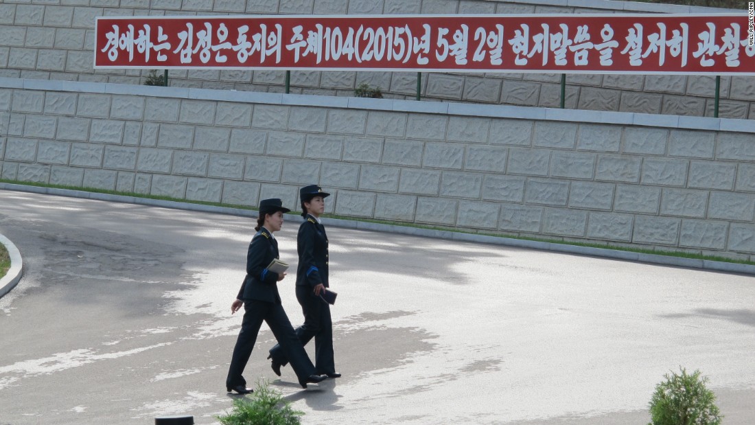 Two officials walk in the grounds of the space facility. NADA officials told CNN that they had prepared multiple satellites and were in the &quot;final stages of perfecting all operations.&quot;