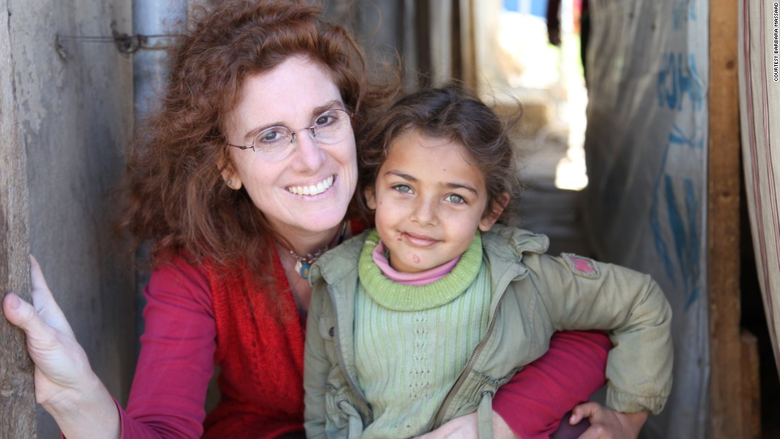 Barbara Massaad poses with a refugee child at the Zahle Lebanon. Her experience at the camp inspired her to create the humanitarian cookbook &quot;Soup for Syria.&quot;