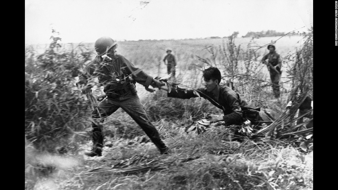 A Vietcong suspect is dragged from his bunker, in South Vietnam in 1965.