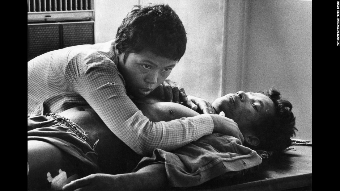 A Cambodian woman clutches the body of her husband, who was killed in the battle for Phnom Penh in 1975.