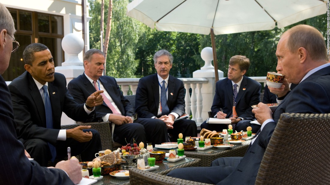 Obama, who had become U.S. President six months earlier, enjoys tea with then-Prime Minister Vladimir Putin and members of the American delegation at Putin&#39;s dacha on July 7, 2009 in Moscow.