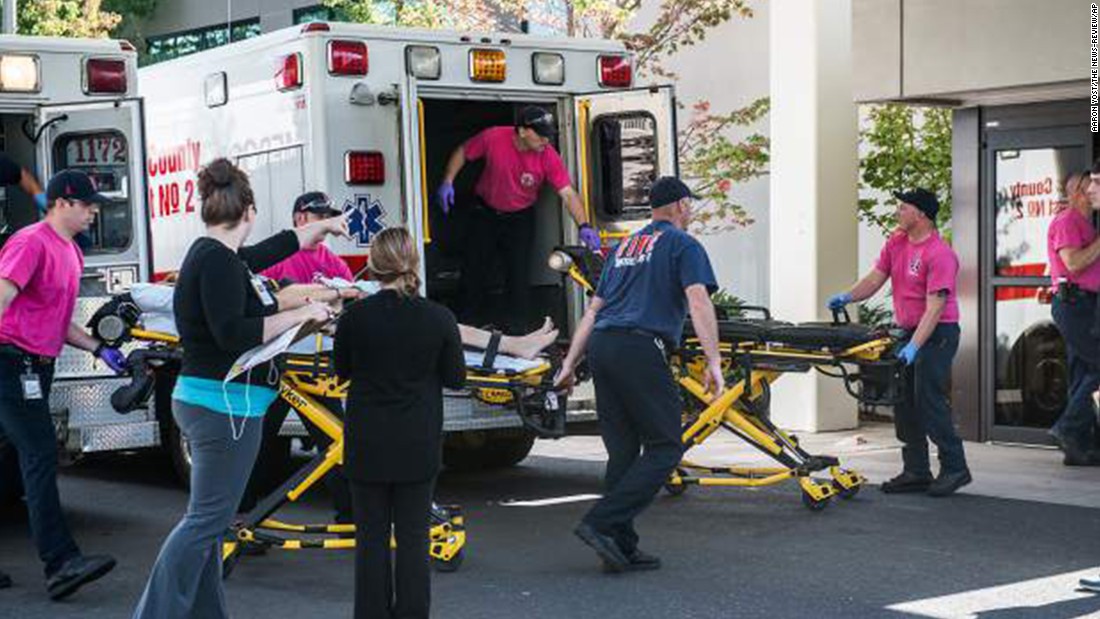 A patient is wheeled into the emergency room at Mercy Medical Center in Roseburg on October 1.