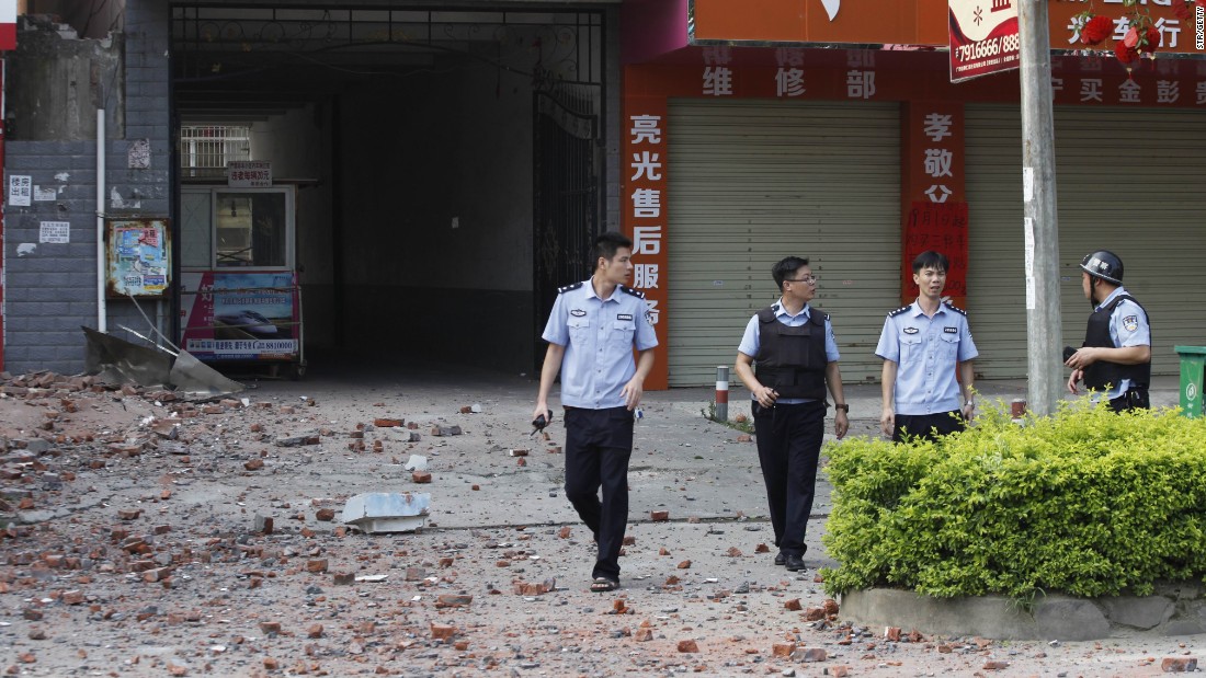 Police investigators inspect the area after a blast. The People&#39;s Daily, a national newspaper, said a man paid couriers to deliver the letter bombs across Liucheng.