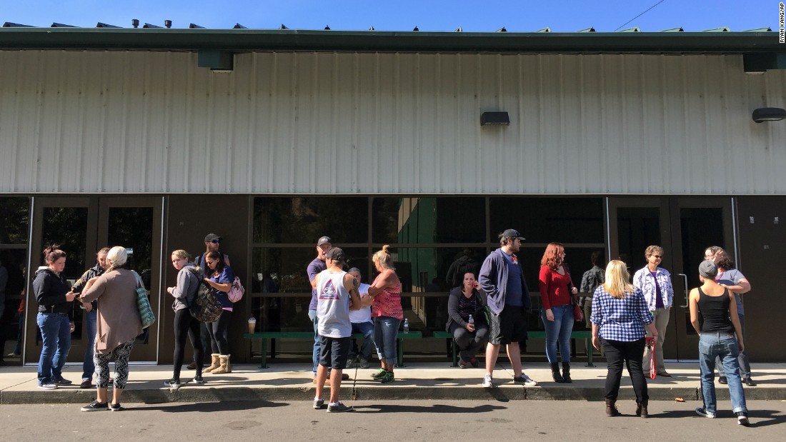 People wait for information at the fairgrounds on October 1.