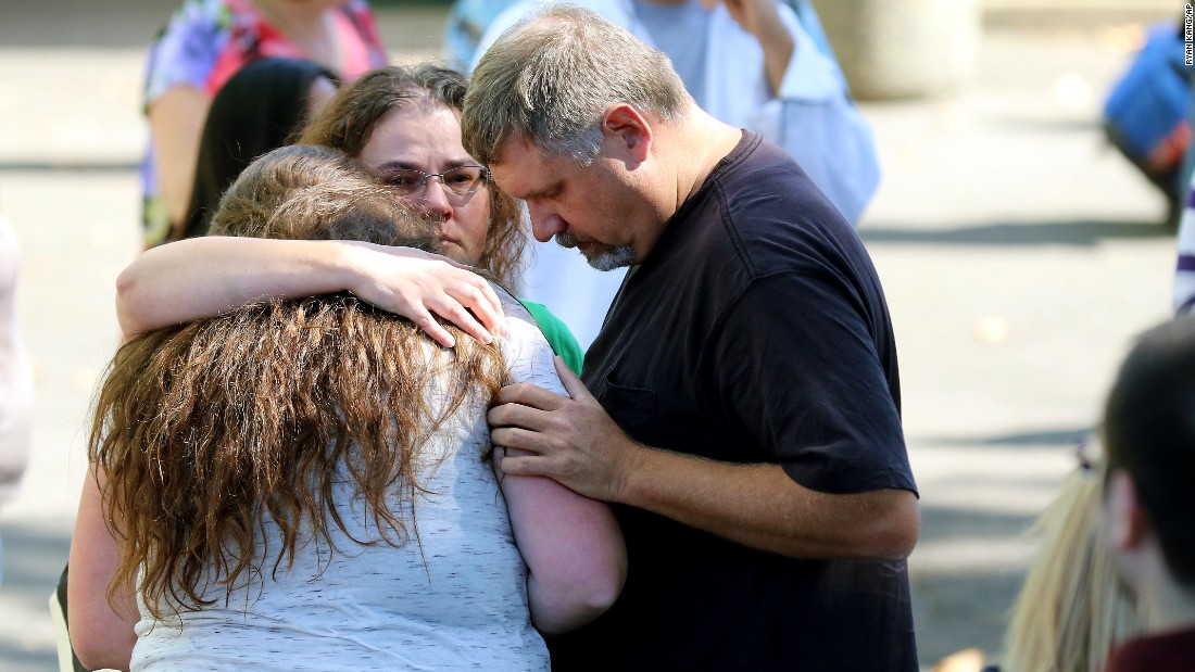 Students and faculty are reunited with friends and family at the county fairgrounds on October 1.