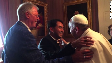 Pope Francis meets with, hugs same-sex couple