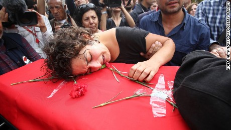 A relative mourns over the coffin of Korkmaz Tedik, a board member of the Turkish Labour Party (EMEP), who was killed in twin bombings in Ankara the day before during his funeral in the capital on October 11, 2015 . Turkey woke in mourning on October 11 after at least 95 people were killed by suspected suicide bombers at a peace rally of leftist and pro-Kurdish activists in Ankara, the deadliest such attack in the country&#39;s recent history. AFP PHOTO /ADEM ALTAN        (Photo credit should read ADEM ALTAN/AFP/Getty Images)