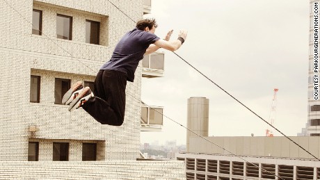 Parkour instructor Dan Edwardes take a spectacular leap in Tokyo.