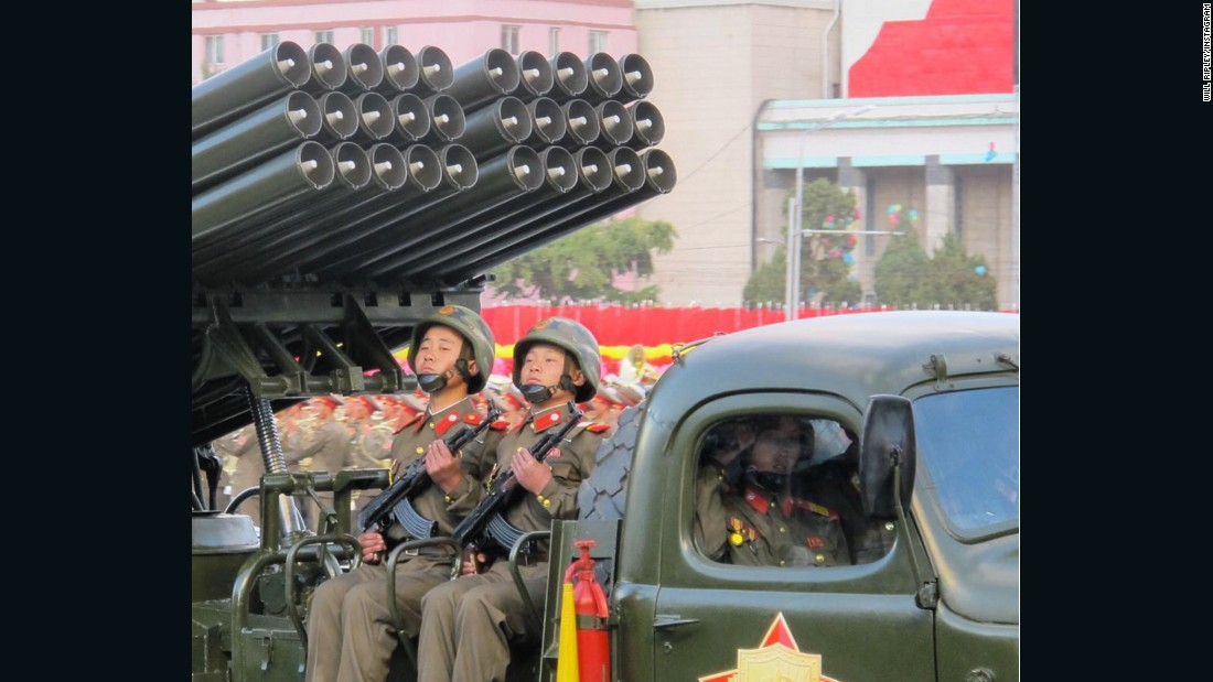 Young members of North Korea&#39;s military ride artillery through Pyongyang.