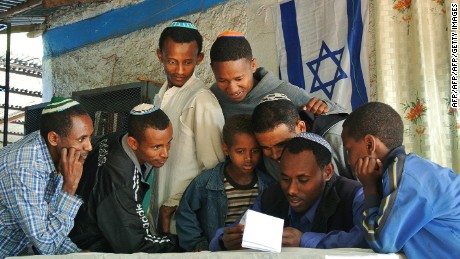 Ethiopian Jews gather at a makeshift synagogue in Gondar, Ethiopia, to see if they have been given a date to move to Israel on November 19, 2012. 