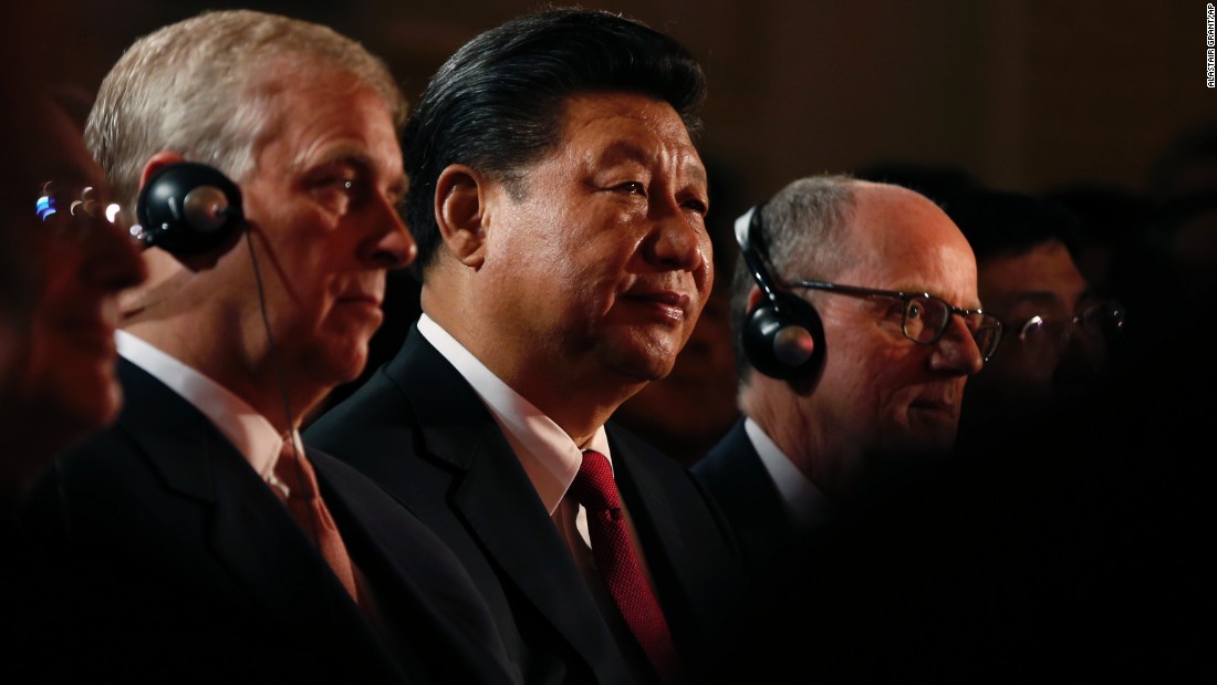Xi sits with Britain&#39;s Prince Andrew, left, at the opening of the UK Confucius Institutes and Confucius Classrooms Annual Conference in London on October 22. 