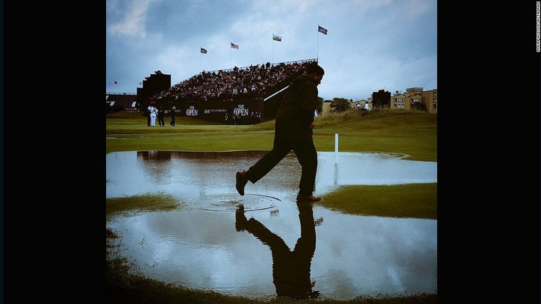 CNN&#39;s &lt;a href=&quot;https://instagram.com/murpho2005/&quot; target=&quot;_blank&quot;&gt;Chris Murphy &lt;/a&gt;captured this shot at St. Andrews soon after the deluge. The gray skies and man skipping through the puddle illustrate just how quickly the rain fell and waterlogged the course. &quot;A tad wet at St Andrews on Friday. All adds to the fun, when you&#39;re sitting in the warm &amp;amp; toasty media center anyway,&quot; he said.
