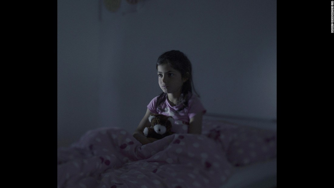 Fatima, 9, sits in bed in Norberg, Sweden. Every night, she said, she dreams that she&#39;s falling from a ship. After two years at a refugee camp in Lebanon, Fatima and her family boarded an overcrowded boat in Libya. On the deck of the boat, a woman gave birth to her baby after 12 hours in the scorching sun. The baby was stillborn and thrown overboard. Fatima saw everything. When their boat started to take on water, they were picked up by the Italian Coast Guard.