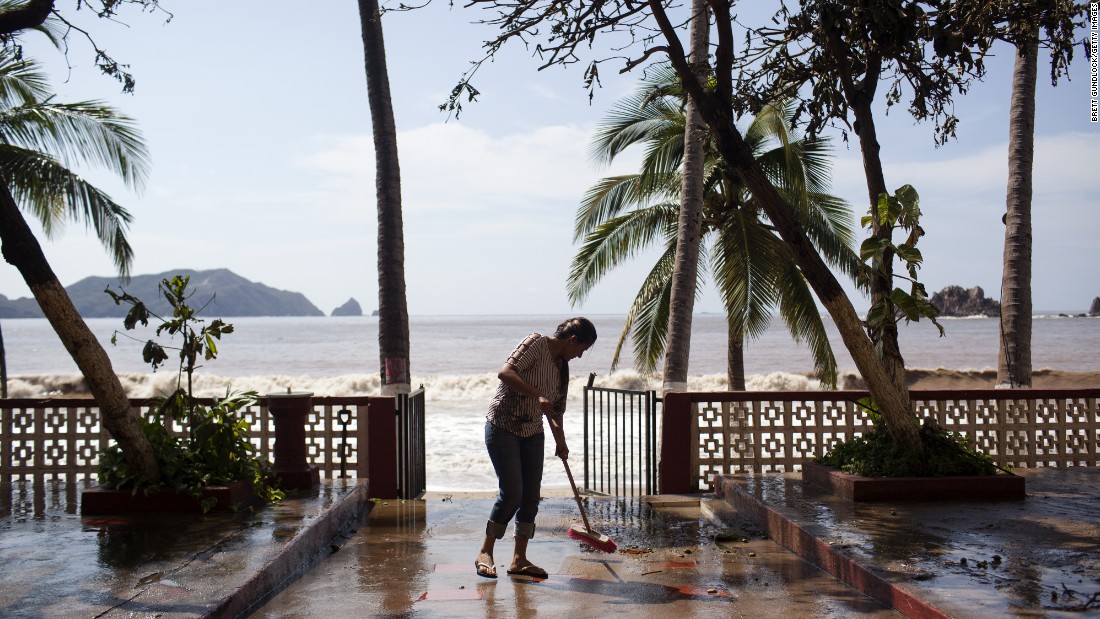 A worker cleans out the Monterey Hotel on October 24 in Melaque, Mexico. 